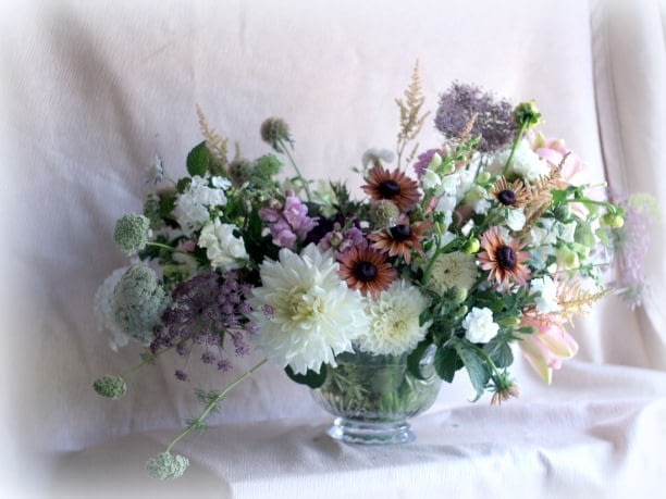 A bouquet with lots of different types of flowers.
